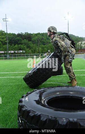 2nd Lt. Brian Trabun, a native of Seattle, WA, assigned to 35th Air Defense Artillery Brigade, flips a tire during the physical fitness challenge during the Eighth Army 2018 Best Warrior Competition, held at Camp Casey, Republic of Korea, May 17. The Eighth Army BWC is being held to recognize and select the most qualified junior enlisted and non-commissioned officer to represent Eighth Army at the U.S. Army Pacific Best Warrior Competition at Schofield Barracks, HI, in June. The competition will also recognize the top performing officer, warrant officer and Korean Augmentation to the U.S. Army Stock Photo