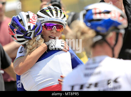 Cross country bikers second JOLANDA NEFF (centre) of Switzerland and third PAULINE FERRAND-PREVOT of France (back) celebrate after the World Cup mountain biking in Nove Mesto na Morave, Czech Republic, May 27, 2018. (CTK Photo/Libor Plihal) Stock Photo