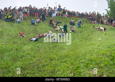 Coopers Hill, Gloucester, UK. 28th May 2018. The Annual Unofficial Cheese Rolling and wake event. Crazy competitions from all over the World gather at the top of a step hill in Gloucestershire to chase a 9lb cheese wheel down it. As in the 200 year old tradition the first to the bottom wins the cheese. Credit: 79Photography/Alamy Live News Stock Photo