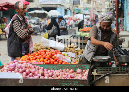 May 16, 2018 - The historic Bab Al- Musa market in the Yemeni city of Taiz becomes very busy with residents shopping during Ramadan. The construction of the market of Bab Musa and the walls of the old city dates back to the Ottoman era in Yemen, with the market developing with the construction of the Bab Al-Musa Gate in the eighth century. Taiz remained a walled city until 1948 when Imam Ahmed allowed for expansion beyond its fortified wall. Taiz, which is located in south-western Yemen, is the third largest city in Yemen, and was its cultural capital until before becoming deeply entangled in Stock Photo