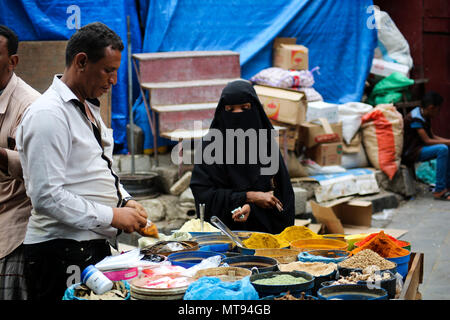 May 16, 2018 - The historic Bab Al- Musa market in the Yemeni city of Taiz becomes very busy with residents shopping during Ramadan. The construction of the market of Bab Musa and the walls of the old city dates back to the Ottoman era in Yemen, with the market developing with the construction of the Bab Al-Musa Gate in the eighth century. Taiz remained a walled city until 1948 when Imam Ahmed allowed for expansion beyond its fortified wall. Taiz, which is located in south-western Yemen, is the third largest city in Yemen, and was its cultural capital until before becoming deeply entangled in Stock Photo