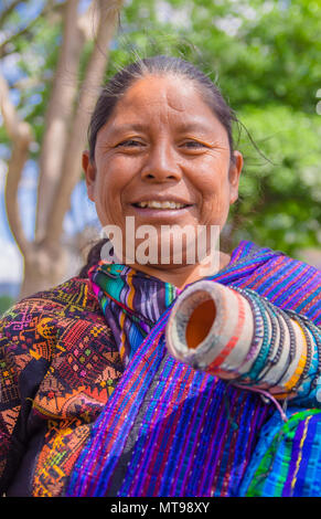 Ciudad de Guatemala, Guatemala, April, 25, 2018: Portrait of Indigenous Mayan market women sell handicrafts to international tourists in the streets and parks in antigua city Stock Photo