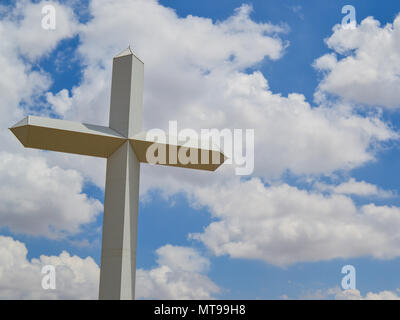 Inspiration and grace from the Christian symbol of calvary and Jesus Christ. This huge cross is located on the road in Texas. A Landmark Stock Photo