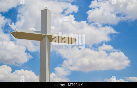 Inspiration and grace from the Christian symbol of calvary and Jesus Christ. This huge cross is located on the road in Texas. A Landmark Stock Photo