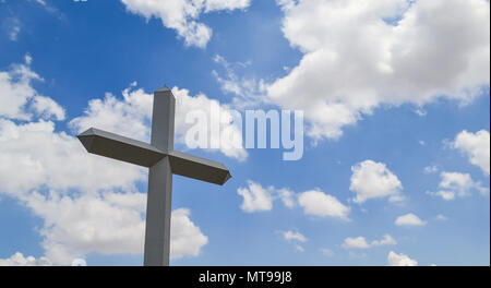 Inspiration and grace from the Christian symbol of calvary and Jesus Christ. This huge cross is located on the road in Texas. A Landmark Stock Photo