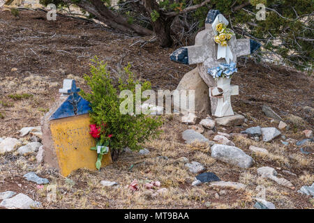Very old grave at San Francisco de Asis Catholic Church in Golden, New Mexico. It was established in 1839. The church celebrates Fiesta de San Francis Stock Photo