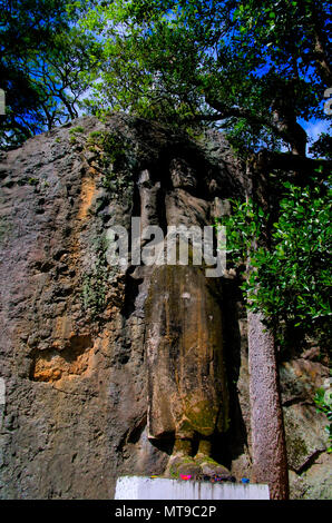 The unfinished Buddha image at Dhowa Raja Maha Vihara rock temple at Bandarawela, Sri Lanka Stock Photo