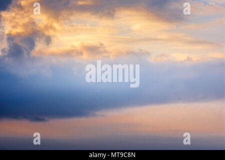 Background of the sky with clouds at sunset. Stock Photo