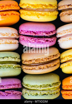 Colorful macaroons on stone table. Stock Photo