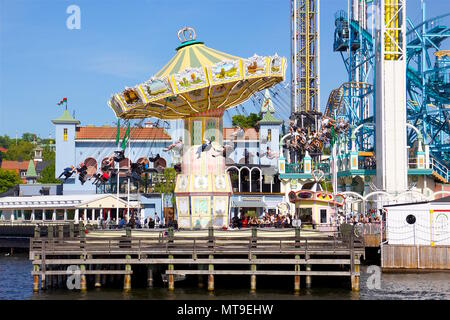 Merry-Go-Round Carousel in amusement theme park, Tivoli Gröna Lund (Luna Park), Djurgarden, Stockholm, Sweden Stock Photo
