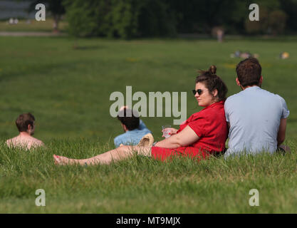 People enjoying the hot weather during a May Bank Holiday in Hampstead Heath, London. Stock Photo