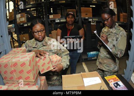 Global Combat Support System–Army is a United States Army web-based logistics system supporting supply, property accountability, and maintenance management. The archival image records advanced individual training students participating in a 92A Automated Logistical Specialist Course session, practicing inventory removal and documentation procedures within the training environment. Stock Photo