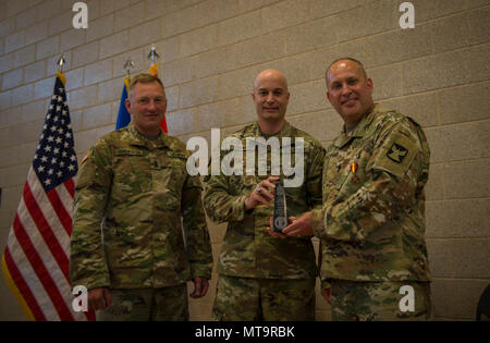 Today we said farewell to Sgt. Maj. Gary McCann, who after 32 total years of service finally laced ‘em up for the last time. During a ceremony that included his wife and three children, McCann was lauded by Col. Stephen Schemenauer, brigade commander, and presented the following: commander’s award for public service, certificate of commendation from the Office of the Governor, Minnesota Medal for Merit and a special plaque from the brigade. “I know you for your candor, and how you care for Soldiers over all,” said Schemenauer. Stock Photo