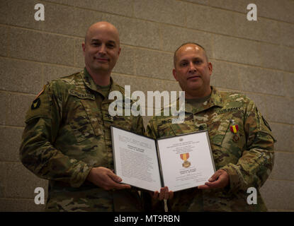 Today we said farewell to Sgt. Maj. Gary McCann, who after 32 total years of service finally laced ‘em up for the last time. During a ceremony that included his wife and three children, McCann was lauded by Col. Stephen Schemenauer, brigade commander, and presented the following: commander’s award for public service, certificate of commendation from the Office of the Governor, Minnesota Medal for Merit and a special plaque from the brigade. “I know you for your candor, and how you care for Soldiers over all,” said Schemenauer. Stock Photo