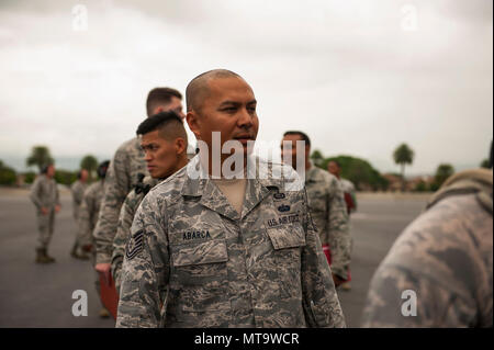 Tech. Sgt. Marlon Abarca, 15th Maintenance Group, boards a C-17 Globemaster III headed for Wheeler Army Airfield, Hawaii to support Exercise TROPIC THUNDER 2017 (XTT17), Joint Base Pearl Harbor-Hickam, Hawaii, April 19, 2017.  XTT17 is a two part full spectrum readiness exercise hosted by the 15th Wing to test the individual, organizational and expeditionary readiness of the Airmen stationed at Hickam Field. Stock Photo