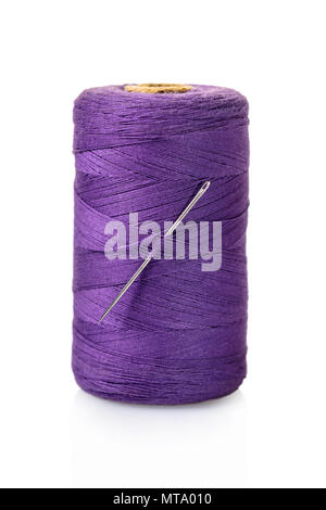 spool of purple threads on a white isolated background Stock Photo