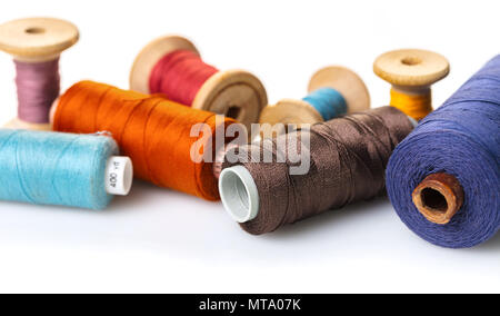 coils with colorful thread on white background Stock Photo