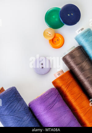 coils with colorful thread on white background Stock Photo