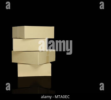 brown paper boxes stacked on blackbackground, can used to move in concept and delivery goods, concept as recycle and save the world because of reused  Stock Photo