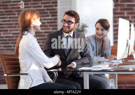 friendly handshake between colleagues in the office Stock Photo