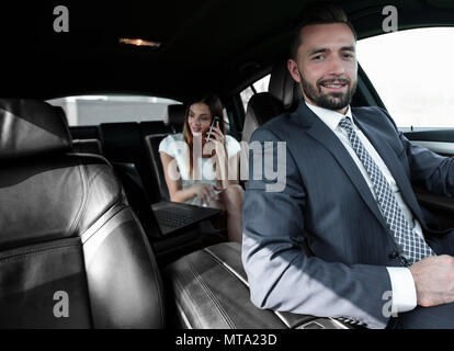 Attractive elegant serious man drives good car Stock Photo