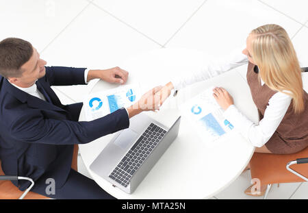 handshake colleagues after drawing up a new financial plan Stock Photo