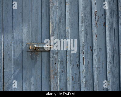 Peeling Paint weathered Door Grey Blue in colour Stock Photo