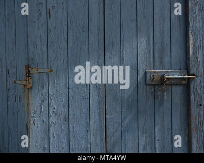 Peeling Paint weathered Door Grey Blue in colour Stock Photo