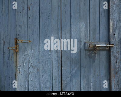 Peeling Paint weathered Door Grey Blue in colour Stock Photo