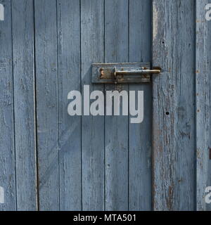 Peeling Paint weathered Door Grey Blue in colour Stock Photo