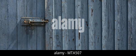 Peeling Paint weathered Door Grey Blue in colour Stock Photo