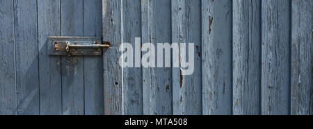 Peeling Paint weathered Door Grey Blue in colour Stock Photo