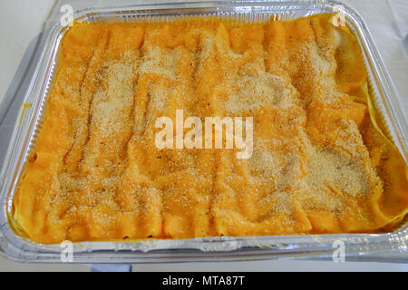 Lasagne type italian pasta with tomato and cream inside. Traditional culture Italy dish Stock Photo