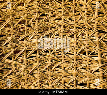 Fragment of an old wicker basket with willow twigs Stock Photo