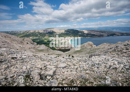 Baska on Island of Krk, Croatia, seen from the top of the karst ridge surrounding it, with the moon-like surface and very little vegetation. Stock Photo