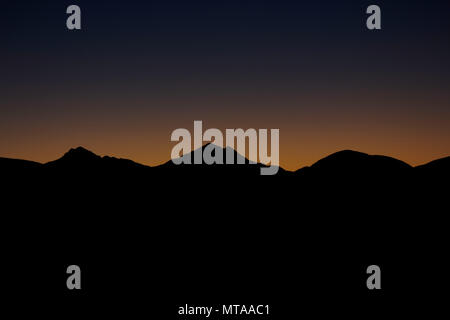 Early Dawn Over Mountainous Peak Horizon Stock Photo