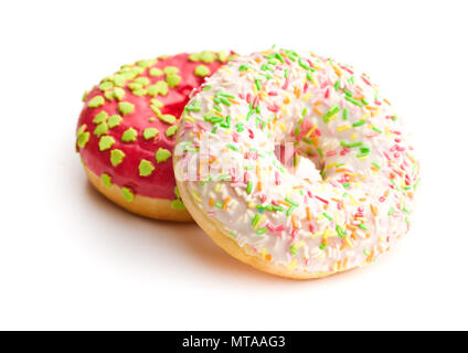 Sweet sprinkled donuts isolated on white background. Stock Photo