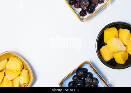 Mango cubes and blueberry in bowl Stock Photo