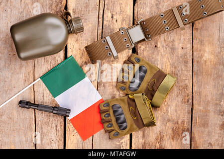 Italian soldier army outfit on wood. Flat lay, top view. Stock Photo