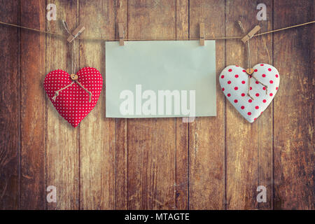 Heart and paper hanging on wood Background and Texture, Vintage toned. Stock Photo