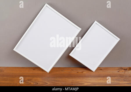 Two blank photo frames for painting or picture on gray background Stock Photo
