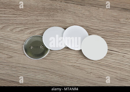 White Badges front and back view on a wooden background Stock Photo