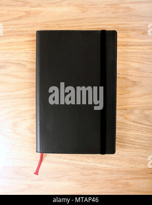 Black copybook with elastic band and bookmark Stock Photo