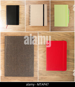 Set closed notebooks on a wooden background Stock Photo