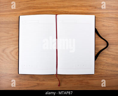 Open blank book with lines, red bookmark and black cover Stock Photo