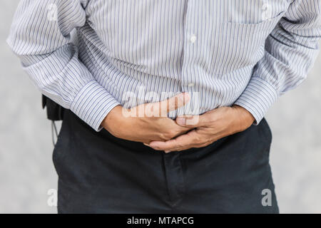 Old man Stomachache. Senior officer stress pain stomach. Stock Photo