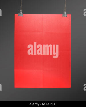 Red poster on a rope Stock Photo