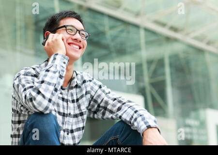 one happy confident young Chinese college student in campus Stock Photo