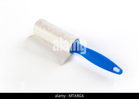 A lint brush used to remove excess fabric and particles from cloth isolated on a white background Stock Photo