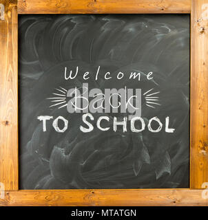 Back to school handwritten with white chalk on a blackboard Stock Photo